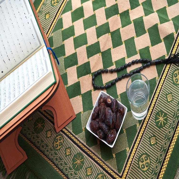 iftar-time-dried-dates-holy-quran-glass-water-tasbih-praying-rug-sejadah-items-representing-fasting-month-ramadan-kareem-concept_530697-45082