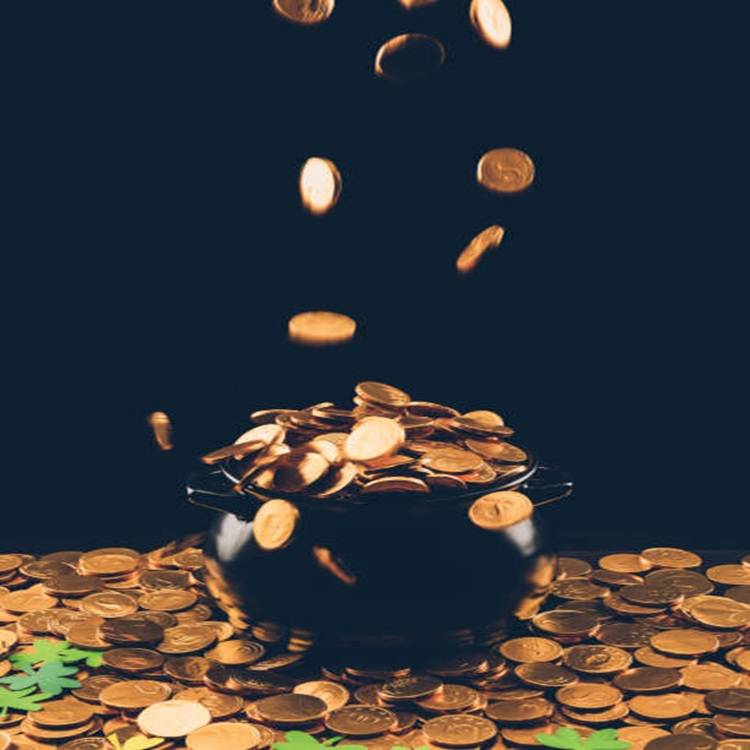 golden coins falling in pot, st patricks day concept